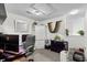 A bonus room featuring a desk and chair and a white armoire with plants throughout at 160 Cart Crossing Dr. # 104, Conway, SC 29526