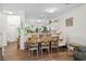 Charming dining area with wood table, comfortable seating, and an open view to the kitchen at 160 Cart Crossing Dr. # 104, Conway, SC 29526