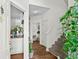 Inviting entryway with wood floors, staircase, and views of the kitchen and bathroom at 160 Cart Crossing Dr. # 104, Conway, SC 29526