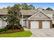 Charming townhouse with two-car garage, brick accents, and well-manicured landscaping at 160 Cart Crossing Dr. # 104, Conway, SC 29526