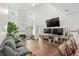 Spacious living room featuring modern furnishings, a fireplace, and natural light at 160 Cart Crossing Dr. # 104, Conway, SC 29526
