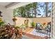 Cozy patio space with brick flooring, decorative rug, comfortable seating, and lush potted plants at 160 Cart Crossing Dr. # 104, Conway, SC 29526