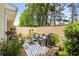 Enclosed patio featuring outdoor seating, a grill, and numerous potted plants for a serene outdoor space at 160 Cart Crossing Dr. # 104, Conway, SC 29526
