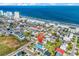 Aerial view of a coastal community, pinpointing a blue beach house near the ocean at 163 Cypress Ave., Murrells Inlet, SC 29576