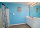 Bright bathroom featuring a single sink vanity, shower/tub combo and nautical themed decorations at 163 Cypress Ave., Murrells Inlet, SC 29576