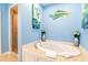 Bright bathroom featuring a soaking tub, walk-in shower, and beach-themed decorations at 163 Cypress Ave., Murrells Inlet, SC 29576