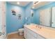Bright bathroom featuring a single sink vanity with decor, a toilet and nautical themed decorations at 163 Cypress Ave., Murrells Inlet, SC 29576