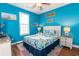 Bright bedroom featuring a single bed with nautical decor, and beach themed decorations at 163 Cypress Ave., Murrells Inlet, SC 29576