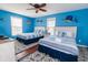 Bright bedroom featuring two beds with nautical decor, and a ceiling fan at 163 Cypress Ave., Murrells Inlet, SC 29576