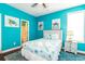 Bright bedroom with coastal decor, a queen bed, and an ensuite bathroom at 163 Cypress Ave., Murrells Inlet, SC 29576