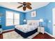 Inviting bedroom with a coastal theme, featuring a comfortable bed, stylish lamps, and nautical decorations at 163 Cypress Ave., Murrells Inlet, SC 29576