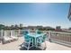 Breathtaking view from the deck, showcasing a relaxing area with blue outdoor seating and white lounge chairs at 163 Cypress Ave., Murrells Inlet, SC 29576