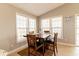 Charming dining area featuring a wooden table, seating for four, and natural light from multiple windows at 163 Cypress Ave., Murrells Inlet, SC 29576