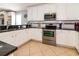 Well-equipped kitchen featuring stainless steel appliances, granite counters, and ample cabinet space at 163 Cypress Ave., Murrells Inlet, SC 29576
