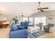 Spacious living area with vaulted ceilings, comfortable seating, tile floors, and sliding glass doors at 163 Cypress Ave., Murrells Inlet, SC 29576