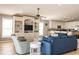 Cozy living room featuring a built-in entertainment center, plush seating, and an open layout to the kitchen at 163 Cypress Ave., Murrells Inlet, SC 29576