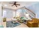 Comfortable living room featuring beach decor, ceiling fan, and staircase at 163 Cypress Ave., Murrells Inlet, SC 29576