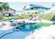 Inviting backyard pool and spa area surrounded by lush tropical landscaping and cozy patio seating at 163 Cypress Ave., Murrells Inlet, SC 29576