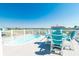 The house's upper deck offers an elevated lounging experience with a pool, chairs, and outdoor seating at 163 Cypress Ave., Murrells Inlet, SC 29576