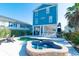 The house's backyard showcases a private pool and hot tub surrounded by lounge chairs, offering a serene retreat at 163 Cypress Ave., Murrells Inlet, SC 29576