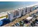 Amazing aerial view of coastal condominiums, revealing proximity to the ocean and nearby amenities at 1903 S Ocean Blvd. S # 808, North Myrtle Beach, SC 29582