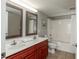 Well-lit bathroom with double vanity, ample counter space, and shower-tub combination at 1903 S Ocean Blvd. S # 808, North Myrtle Beach, SC 29582