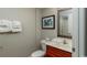 Bright bathroom with a granite sink and framed mirror above the toilet at 1903 S Ocean Blvd. S # 808, North Myrtle Beach, SC 29582