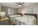 Bright bedroom with two beds, ceiling fan, and coastal decor at 1903 S Ocean Blvd. S # 808, North Myrtle Beach, SC 29582