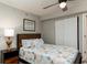 Bedroom with a ceiling fan, a queen bed, and sliding closet doors at 1903 S Ocean Blvd. S # 808, North Myrtle Beach, SC 29582