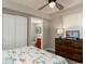 Bedroom boasts a ceiling fan, a queen bed, and a closet at 1903 S Ocean Blvd. S # 808, North Myrtle Beach, SC 29582