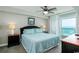 Comfortable main bedroom with calming decor and sliding glass door access to a private balcony at 1903 S Ocean Blvd. S # 808, North Myrtle Beach, SC 29582