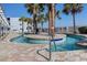 Unique water feature surrounded by palm trees, creating a serene and tropical atmosphere at 1903 S Ocean Blvd. S # 808, North Myrtle Beach, SC 29582