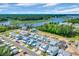 Aerial view of a neighborhood showcasing waterway views, landscaping, and community design at 1957 Indigo Cove Ln, Calabash, NC 28467