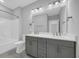 Bathroom featuring a double vanity, tub and shower combo at 1957 Indigo Cove Ln, Calabash, NC 28467