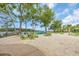 Sandy beach area with comfortable green Adirondack chairs and views of the water at 1957 Indigo Cove Ln, Calabash, NC 28467
