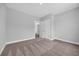 Bedroom with neutral carpet, paint and base trim with interior door at 1957 Indigo Cove Ln, Calabash, NC 28467