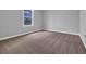 Bedroom with neutral carpet, paint and base trim with a view out the window at 1957 Indigo Cove Ln, Calabash, NC 28467
