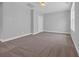 Bedroom with neutral carpet, paint and base trim with a large window at 1957 Indigo Cove Ln, Calabash, NC 28467
