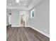 Large bedroom has wood look floors, recessed lighting and an attached bathroom with a glass shower at 1957 Indigo Cove Ln, Calabash, NC 28467