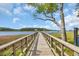 Scenic boardwalk leading to a gazebo on the water, offering picturesque views and a serene atmosphere at 1957 Indigo Cove Ln, Calabash, NC 28467