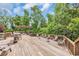 Spacious wooden deck offers ample seating and gathering spaces in a lush, green setting at 1957 Indigo Cove Ln, Calabash, NC 28467