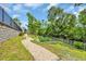 Community garden with stone path amid landscaped yard at 1957 Indigo Cove Ln, Calabash, NC 28467
