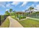 Community gazebo with seating and a bocce ball court surrounded by manicured greenery at 1957 Indigo Cove Ln, Calabash, NC 28467