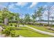 Community green space featuring walking path, kayak storage, and lush landscaping near waterfront at 1957 Indigo Cove Ln, Calabash, NC 28467