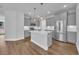Bright and open kitchen features an eat-in island, modern appliances, and abundant storage at 1957 Indigo Cove Ln, Calabash, NC 28467
