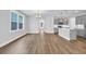 Inviting living space merges seamlessly with a modern kitchen with an eat-in kitchen island at 1957 Indigo Cove Ln, Calabash, NC 28467