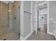 Modern bathroom featuring a glass-enclosed shower with tile surround and neutral walls at 1961 Indigo Cove Ln, Calabash, NC 28467