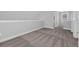 Spacious bedroom with neutral carpeting and paint, features a sloped ceiling and a bright window at 1961 Indigo Cove Ln, Calabash, NC 28467