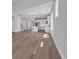 Open-concept home featuring a modern kitchen island, white cabinets, and stainless steel appliances at 1961 Indigo Cove Ln, Calabash, NC 28467