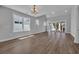 Spacious living area filled with natural light, featuring sliding doors leading to an outdoor space at 1961 Indigo Cove Ln, Calabash, NC 28467